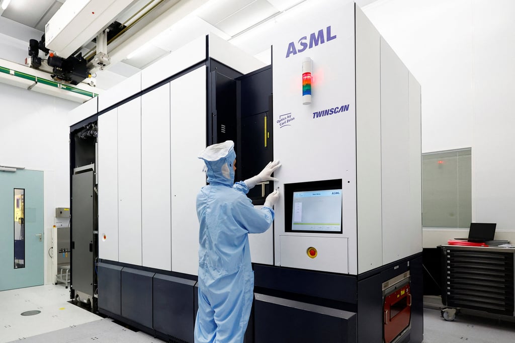 An assembly engineer works on a TWINSCAN DUV lithography system at ASML in Veldhoven, the Netherlands. Photo: Reuters